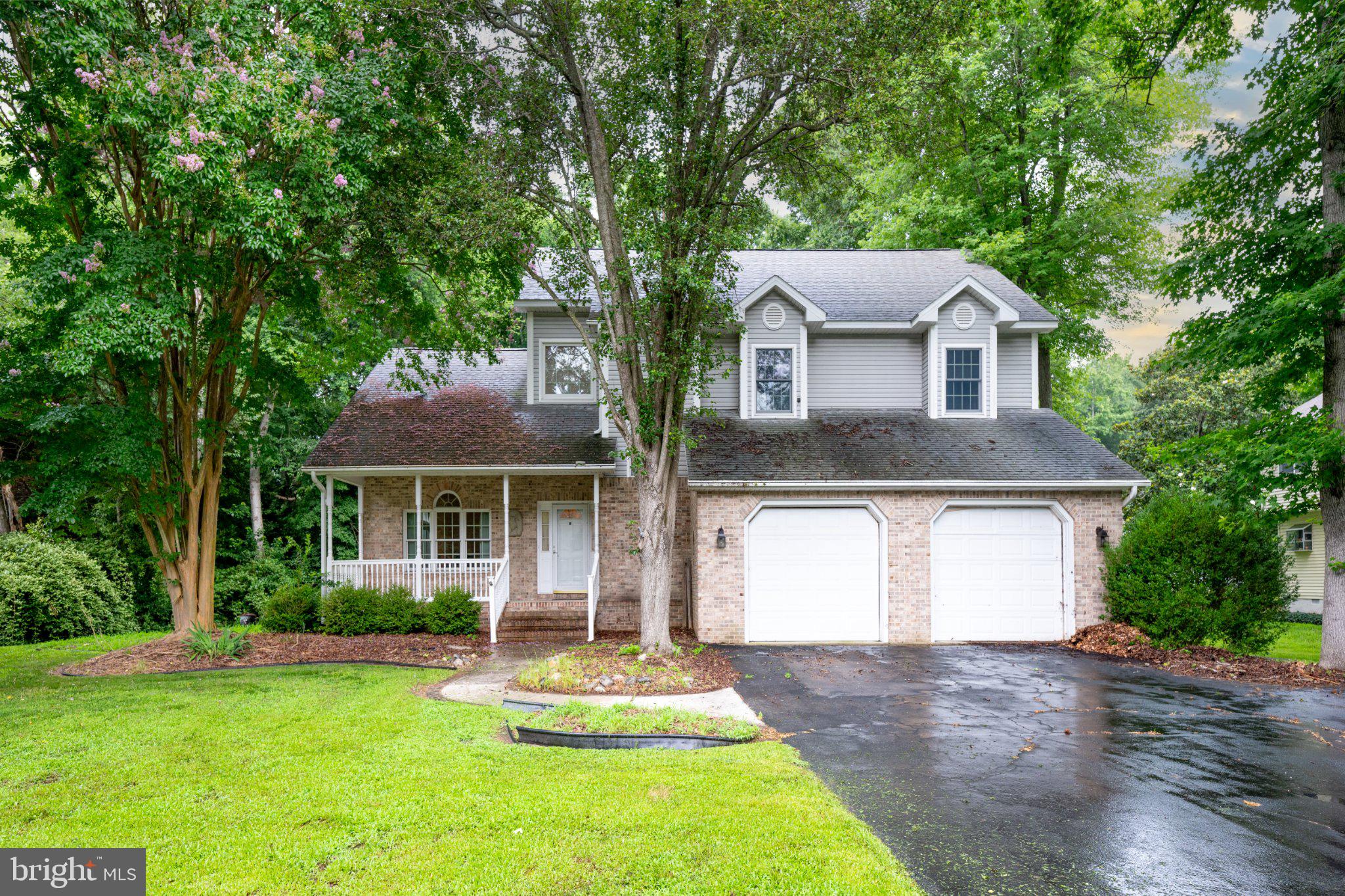 36314 Old Mill Pond Road Selbyville, DE 19975 - Photo 2 of 45 Charming home nestled in lush greenery.
