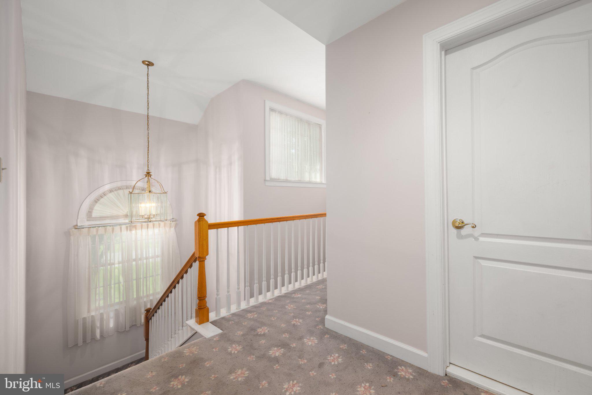 36314 Old Mill Pond Road Selbyville, DE 19975 - Photo 34 of 45 Bright and inviting upstairs hallway.