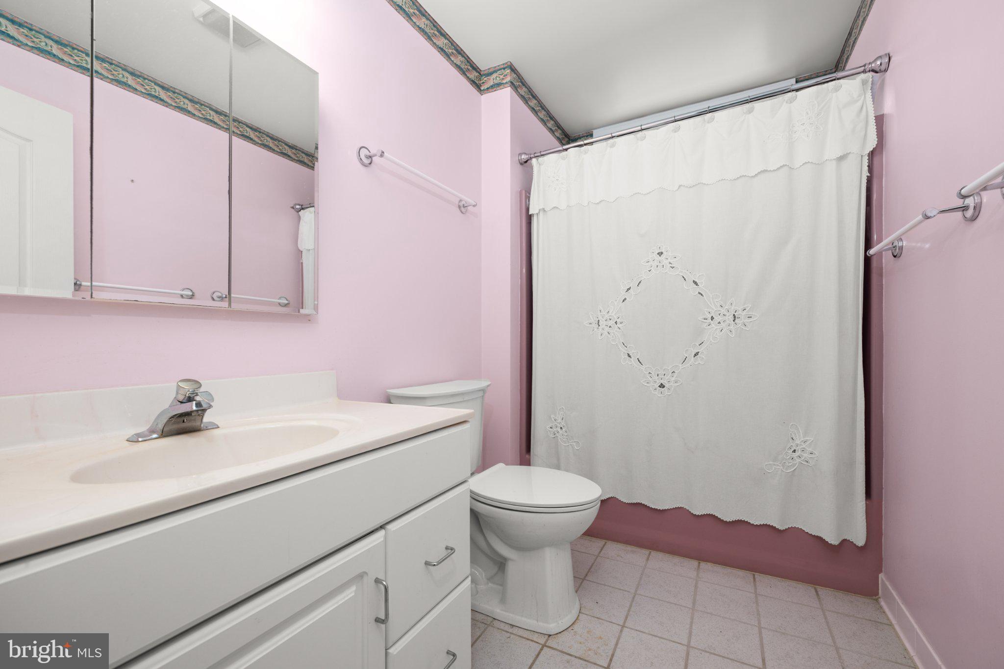36314 Old Mill Pond Road Selbyville, DE 19975 - Photo 38 of 45 Charming pastel bathroom retreat.
