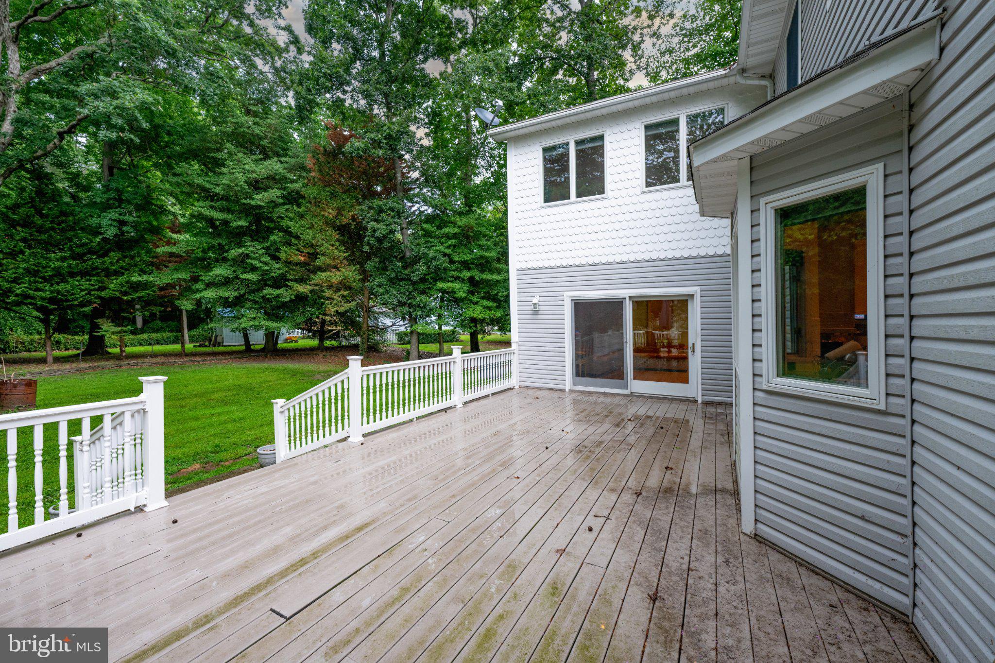 36314 Old Mill Pond Road Selbyville, DE 19975 - Photo 41 of 45 Serene deck overlooking lush greenery.