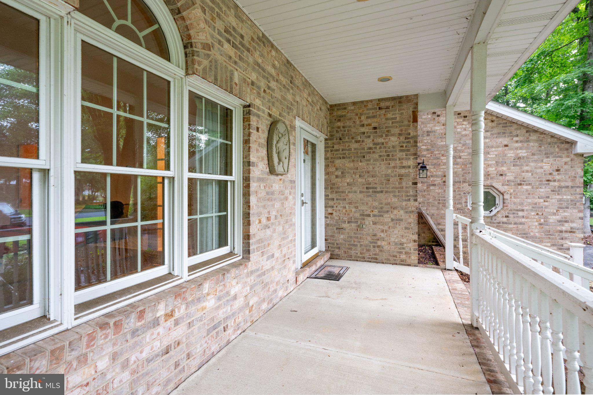 36314 Old Mill Pond Road Selbyville, DE 19975 - Photo 45 of 45 Charming entryway with brick accents.