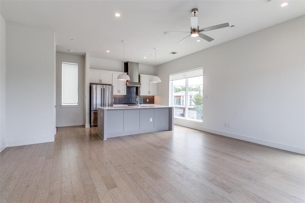 5515 Bryan Parkway, Unit 101 Dallas, TX 75206 - Photo 8 of 19 a view of a kitchen with a sink cabinets and wooden floor