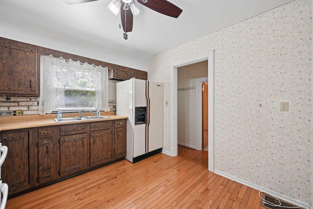 5100 Winton Road Fairfield, OH 45014 - Photo 6 of 38 The cozy kitchen has hardwood floors
