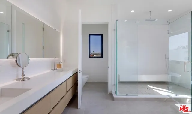 a bathroom with a sink and mirror