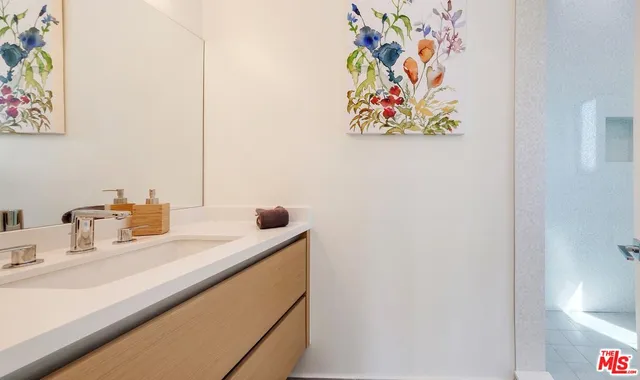 a bathroom with a sink and a mirror