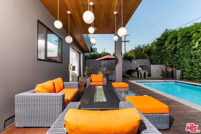 a outdoor space with pool tables and chairs