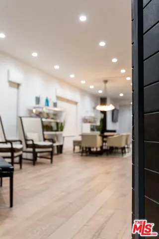 a view of kitchen with furniture and appliances
