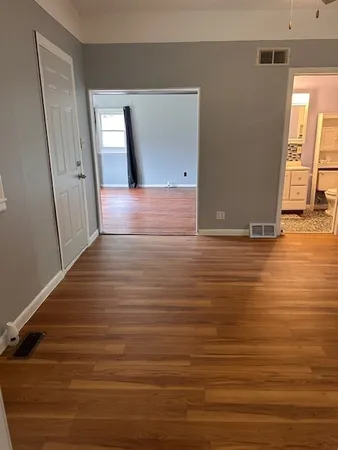a view of a livingroom with wooden floor