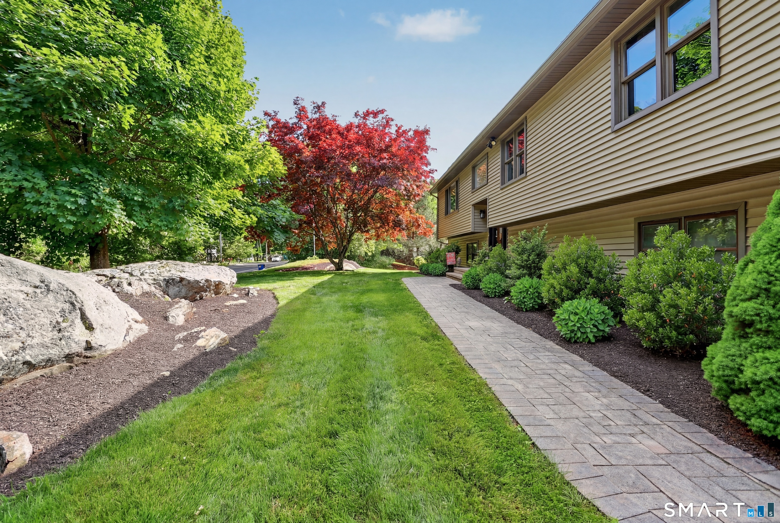 632 Wheelers Farm Road Orange, CT 06477 - Photo 37 of 39 a view of a house with a yard