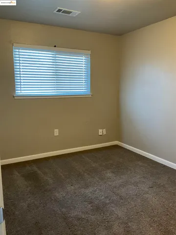 a bathroom with a sink a toilet a mirror and shower