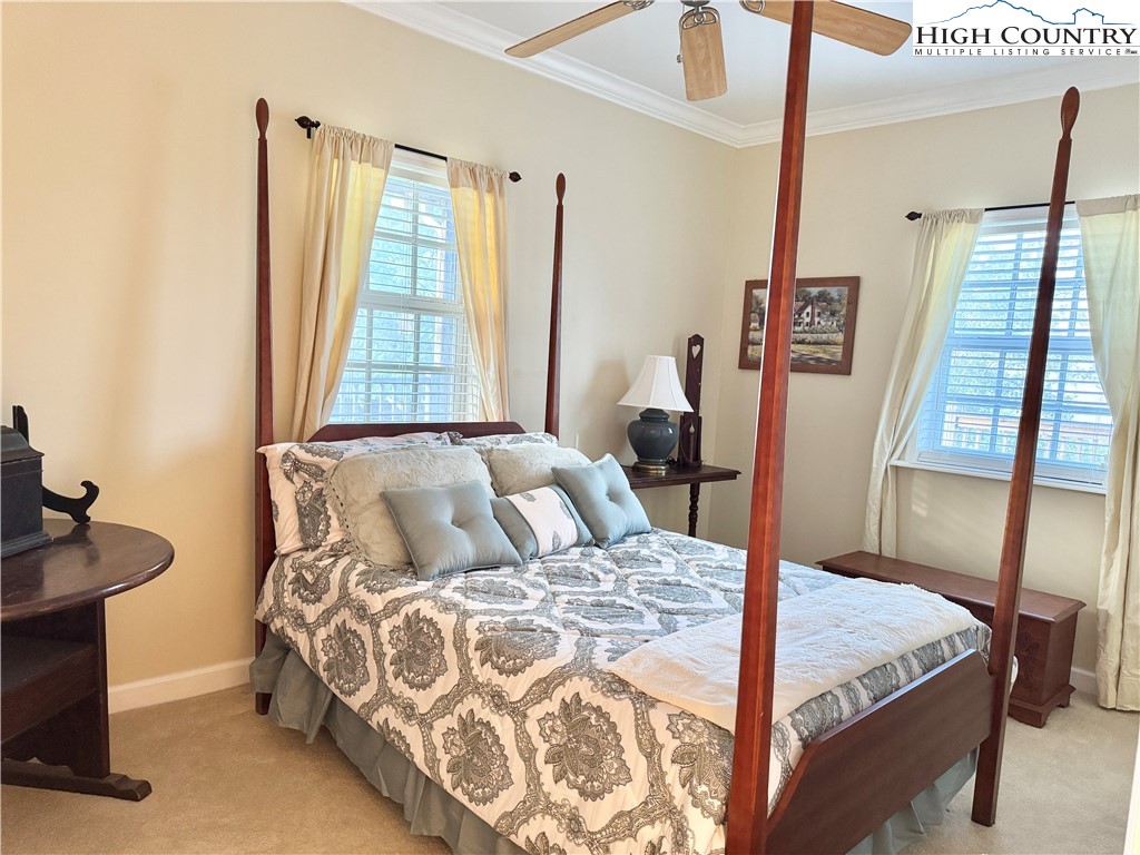 175 Olive Ridge Drive Crumpler, NC 28617 - Photo 37 of 50 a bedroom with a bed and a window
