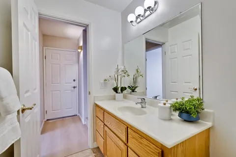 a living room with furniture and stairs