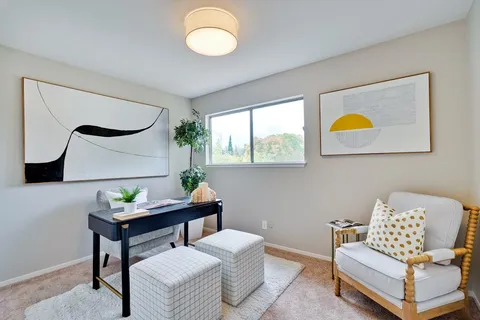 a bedroom with a bed and a couch