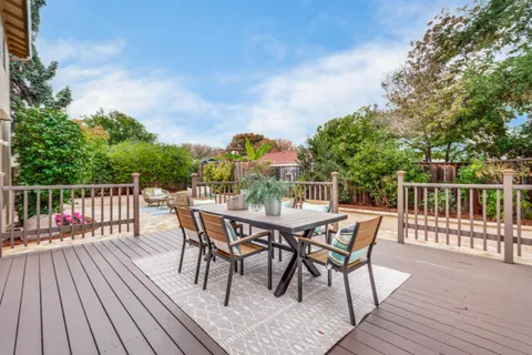 a view of a chairs and table on the deck