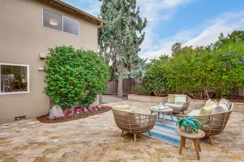 a dining space with furniture and wooden floor