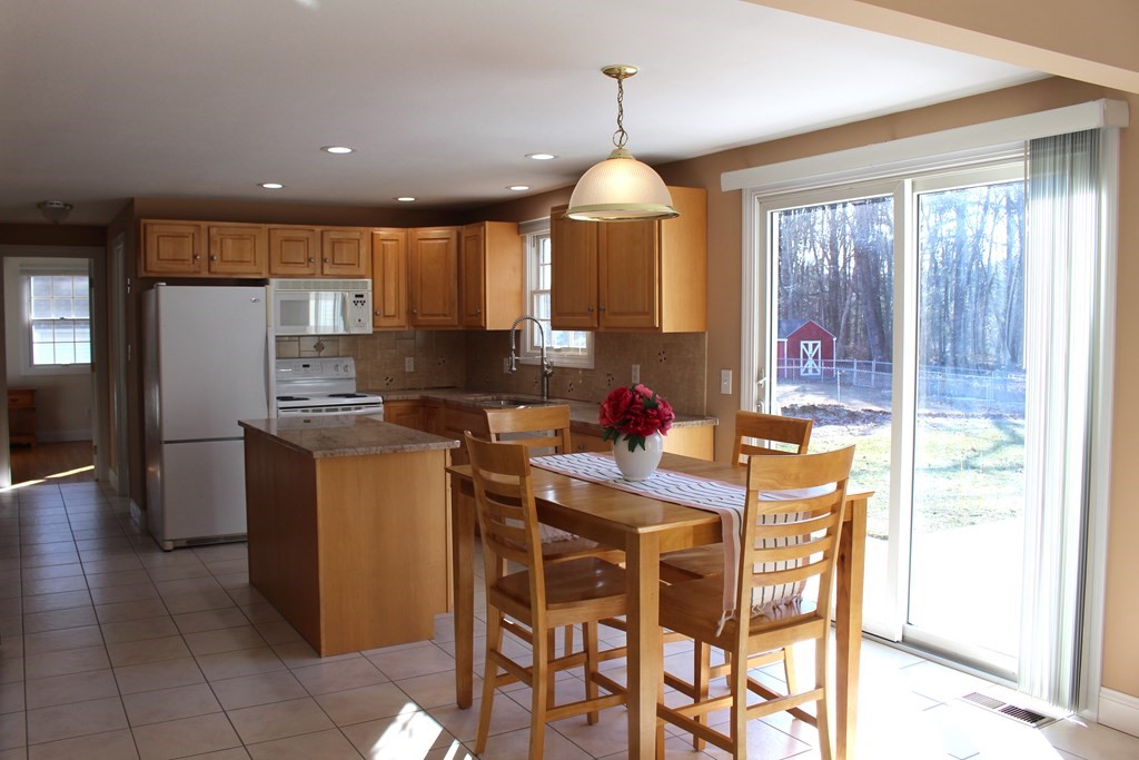 32 Three Rivers Road Wilbraham, MA 01095 - Photo 4 of 26 a kitchen with stainless steel appliances kitchen island granite countertop a sink and a refrigerator
