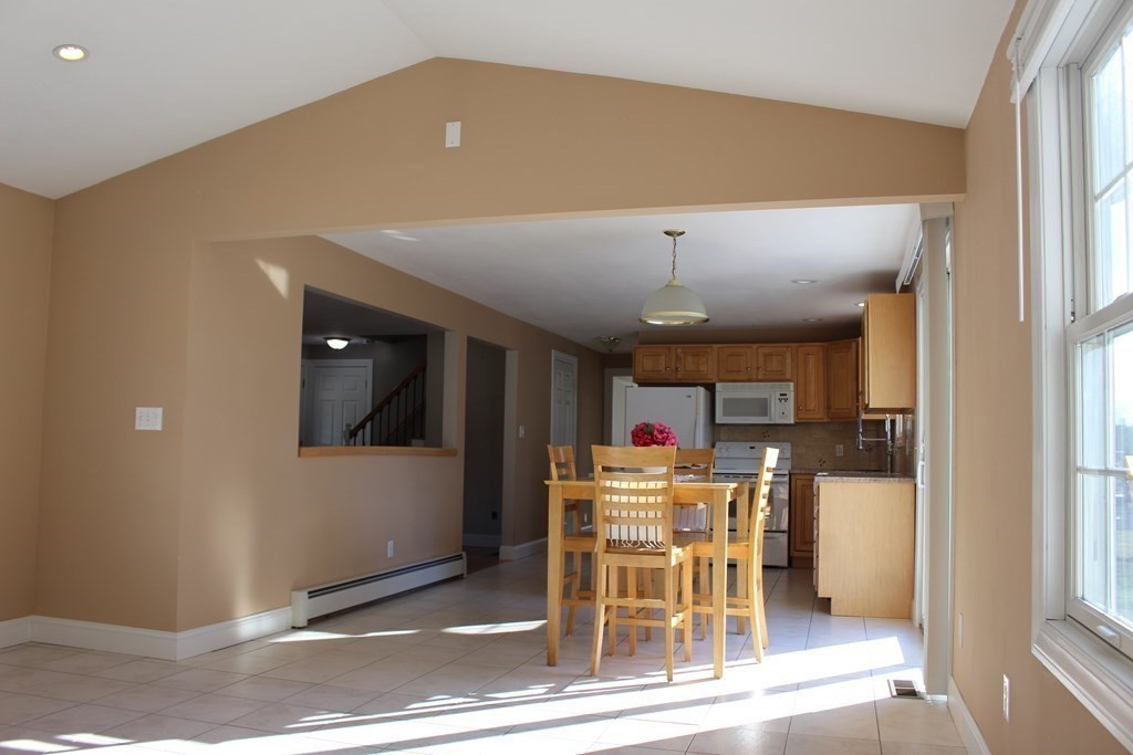 32 Three Rivers Road Wilbraham, MA 01095 - Photo 8 of 26 a open kitchen with a table and chairs