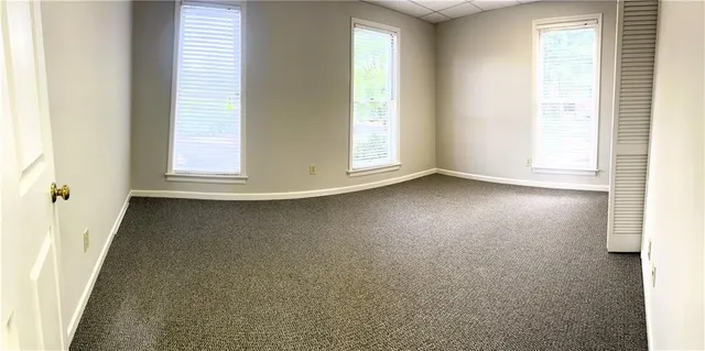 an empty room with windows