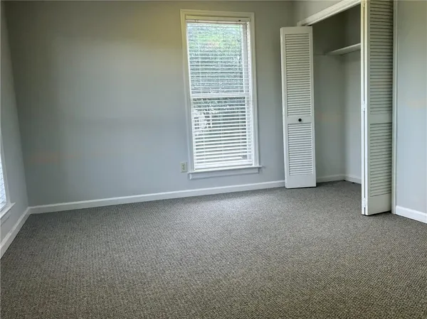 an empty room with windows
