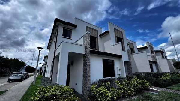 a view of a building with a yard