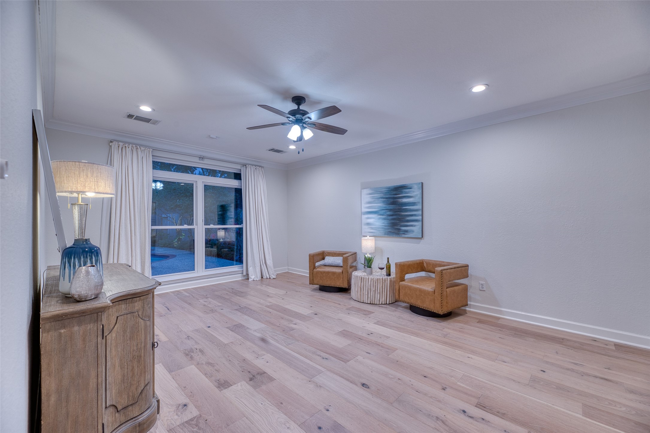 19303 Allview Lane Houston, TX 77094 - Photo 24 of 50 Primary bedroom with wood flooring, ceiling fan and view of gorgeous backyard.