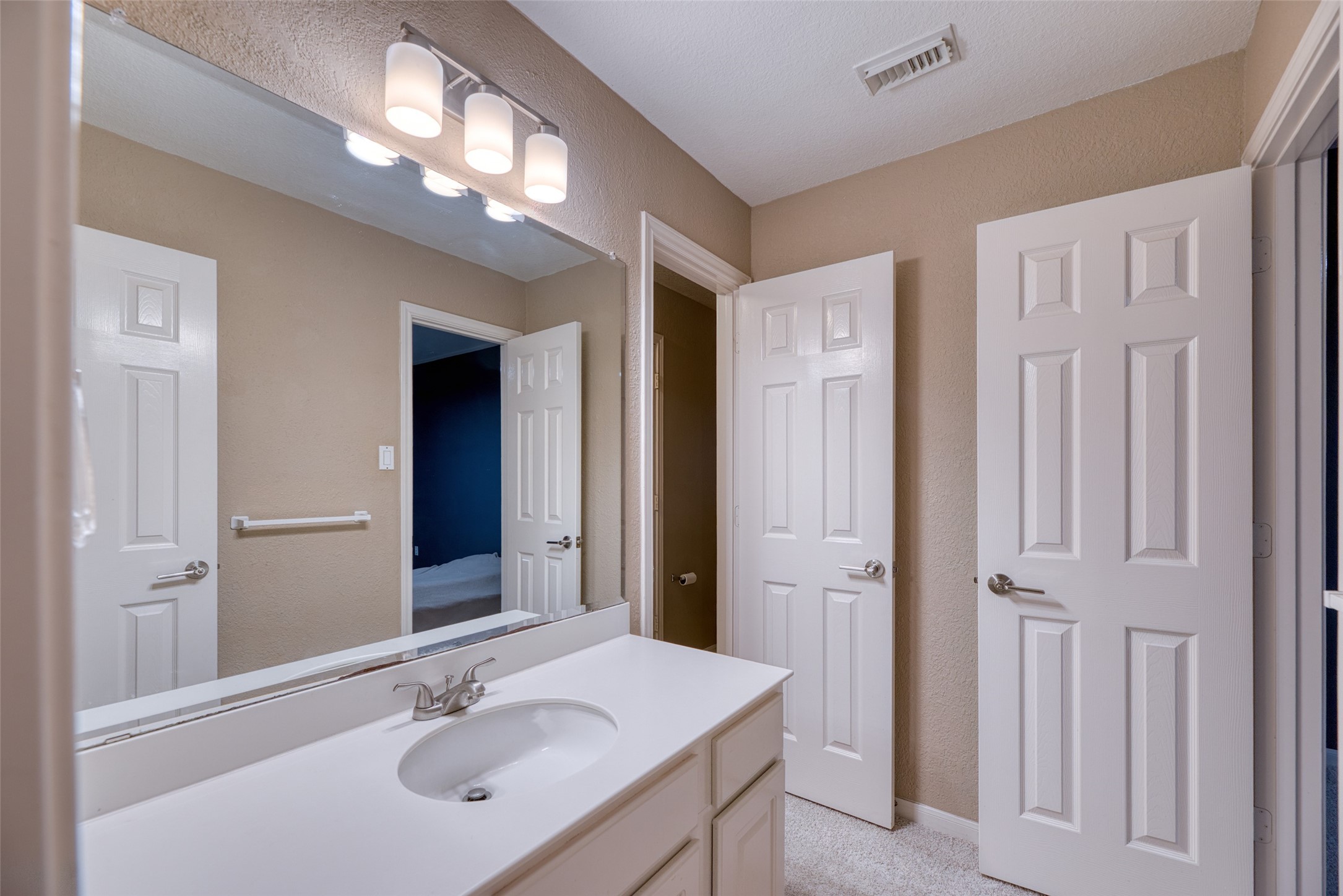 19303 Allview Lane Houston, TX 77094 - Photo 39 of 50 Secondary bathroom with extended vanity and modern lighting.