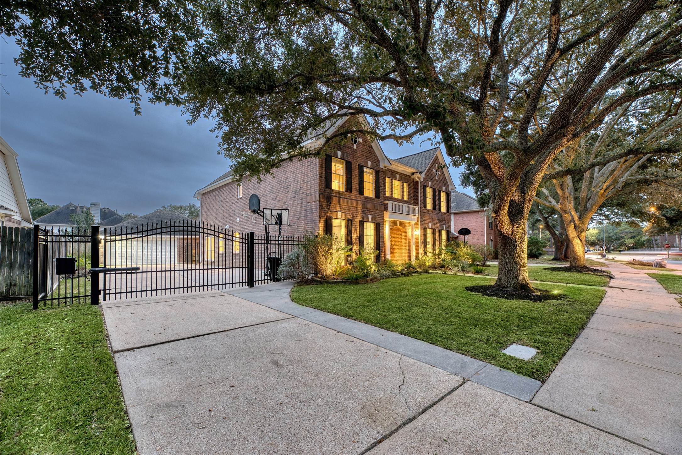 19303 Allview Lane Houston, TX 77094 - Photo 43 of 50 Gated driveway and extended driveway space with mature shade trees.
