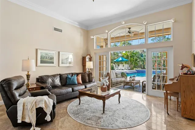 a kitchen with kitchen island a white counter top space cabinets and stainless steel appliances