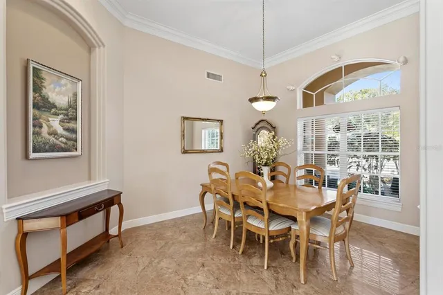 a kitchen with a sink a stove and chairs