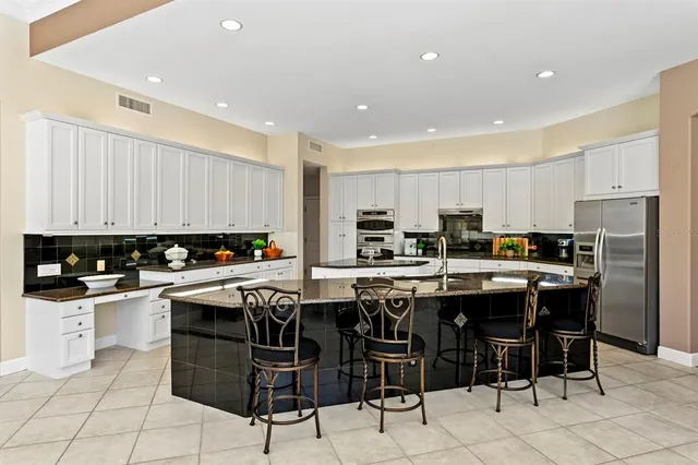 a view of a dining room with furniture and window
