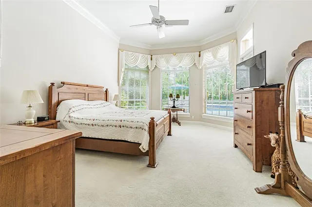 a spacious bathroom with a granite countertop sink a toilet a mirror and a bathtub