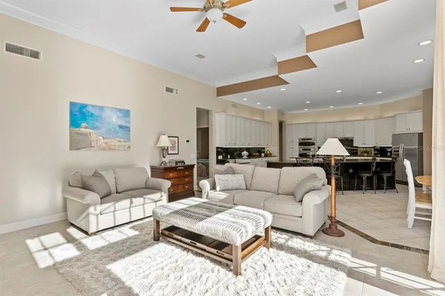 a spacious bedroom with a bed and a dresser