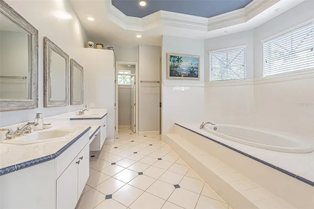 a bedroom with a bed dresser and window