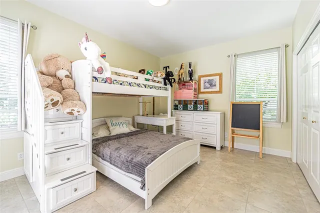 a spacious bathroom with a sink and a mirror
