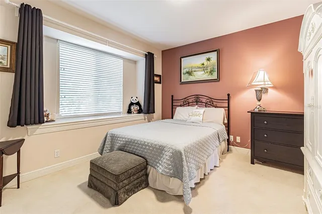 a view of living room with furniture and book shelf