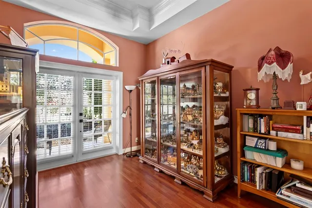 a view of a house with swimming pool and sitting area