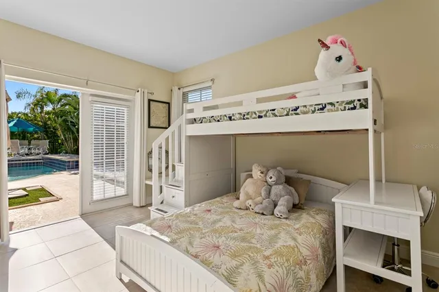 a view of a house with sitting area and swimming pool