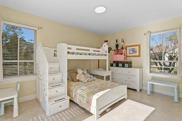 a view of house with swimming pool outdoor seating