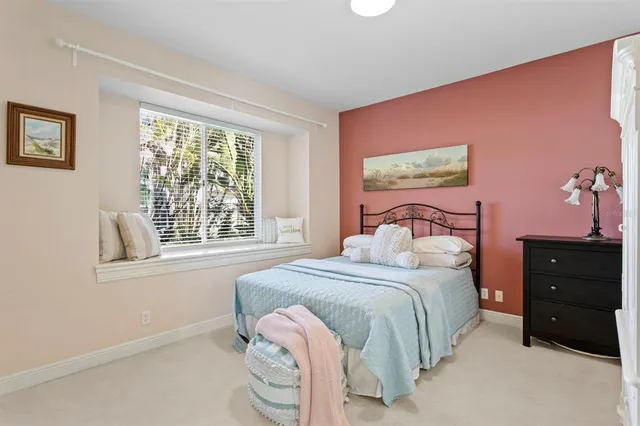 a view of a chairs and table in patio with a swimming pool