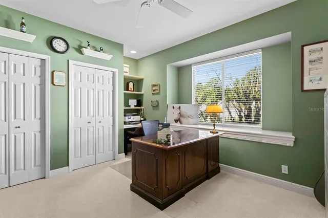 a view of a chairs and table under an umbrella