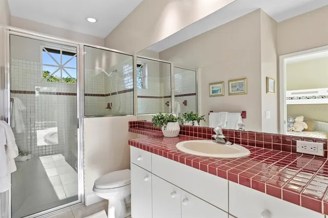 a view of a large garden with plants and large trees