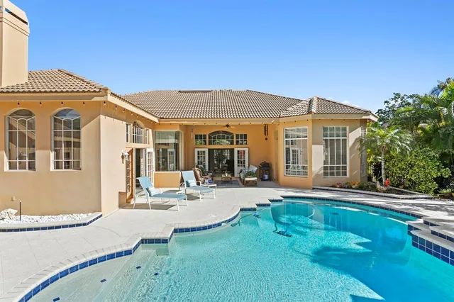 an aerial view of a house with a garden