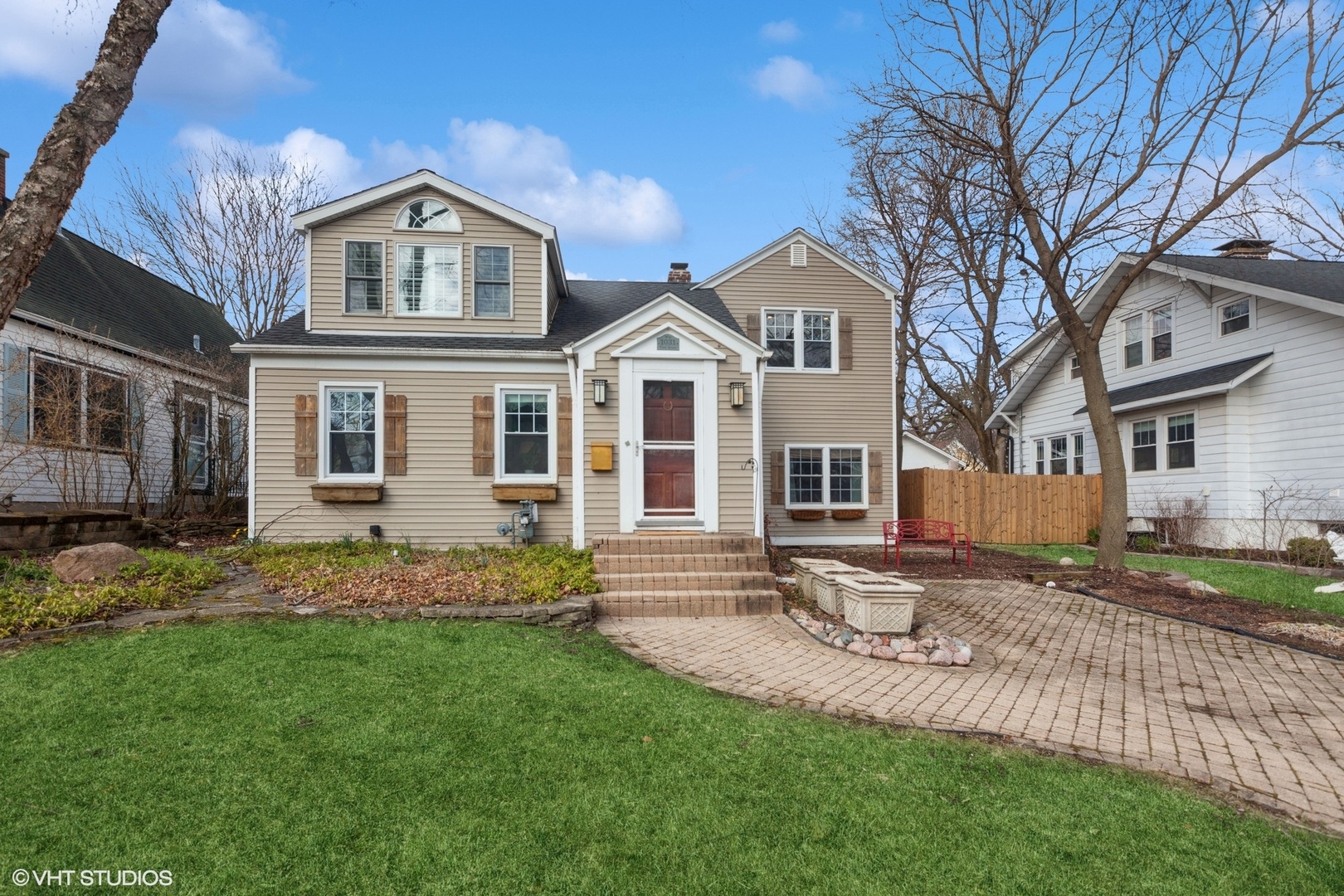 a front view of a house with a garden