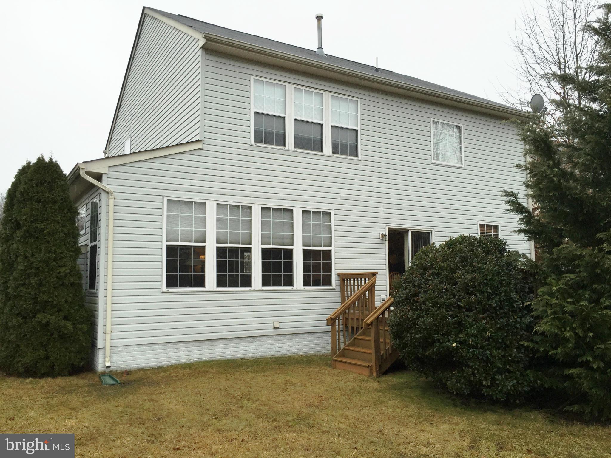 8462 Catia Lane Springfield, VA 22153 - Photo 2 of 3 a view of a house with a garden