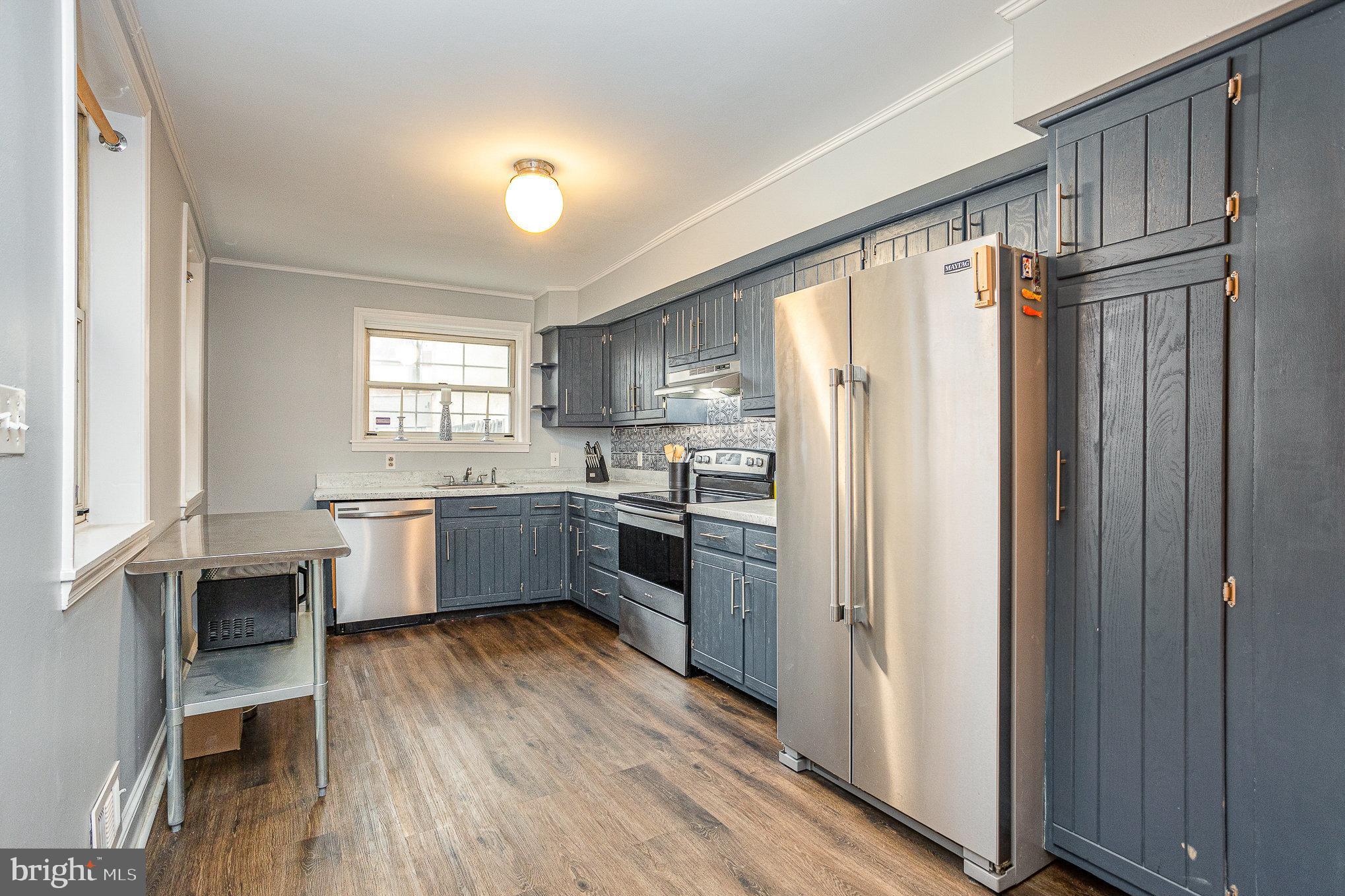 604 Washington Boulevard Baltimore, MD 21230 - Photo 11 of 30 a kitchen with stainless steel appliances a refrigerator sink and cabinets