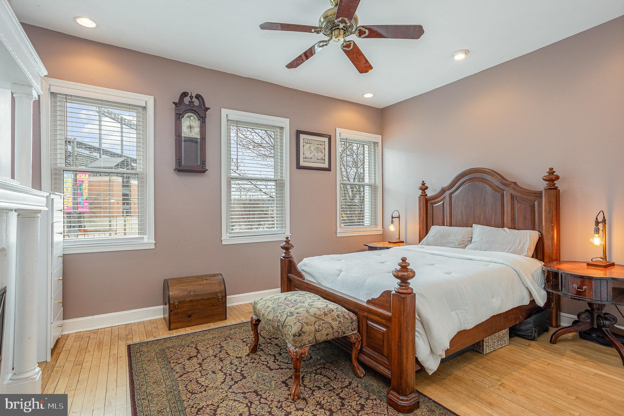 604 Washington Boulevard Baltimore, MD 21230 - Photo 17 of 30 a bedroom with a bed and wooden floor