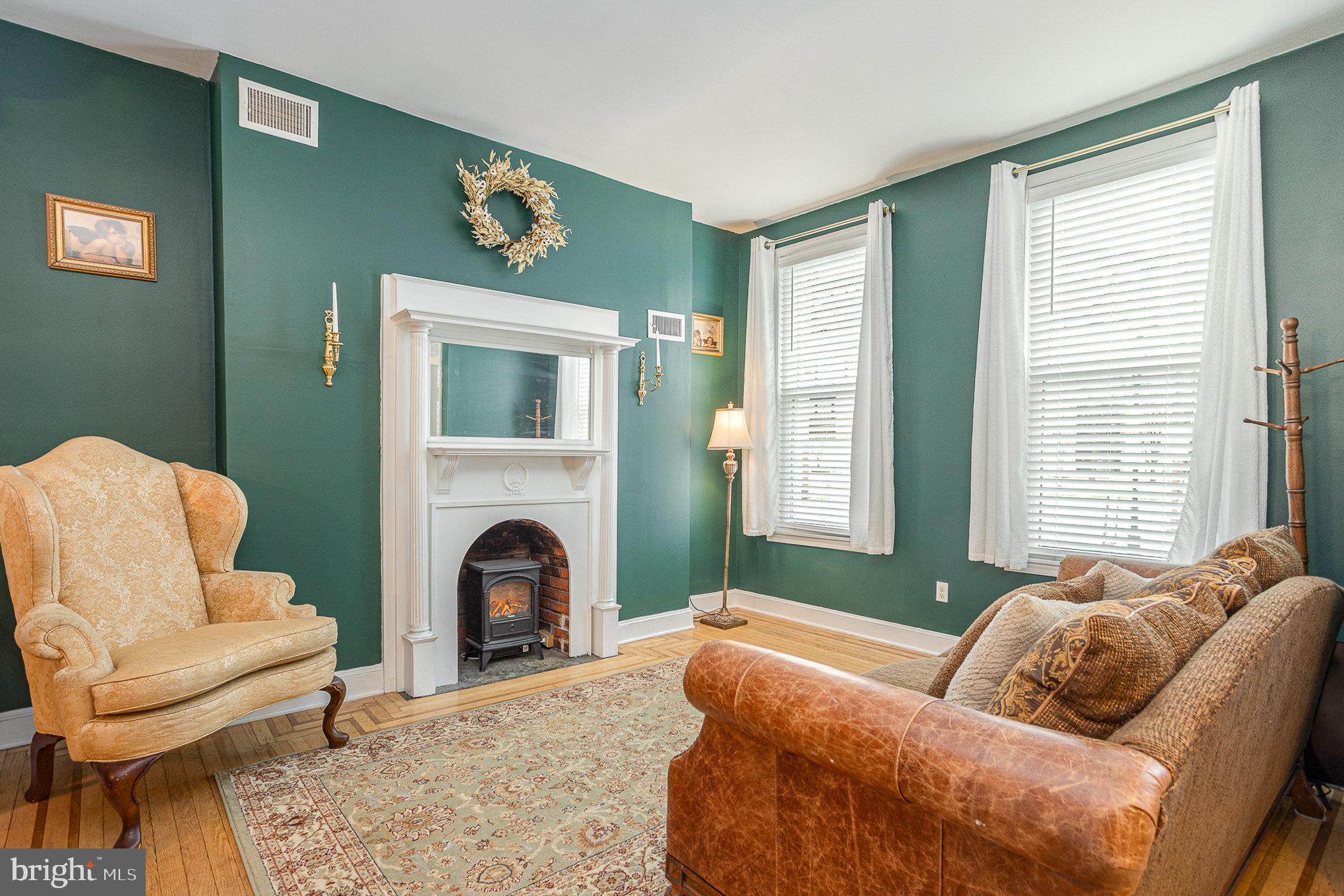 604 Washington Boulevard Baltimore, MD 21230 - Photo 2 of 30 a living room with furniture and a fireplace