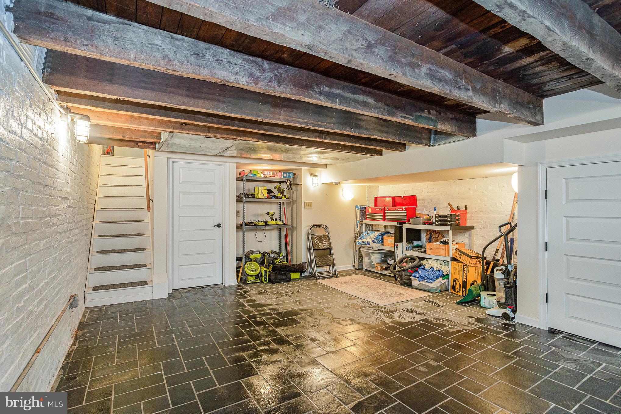 604 Washington Boulevard Baltimore, MD 21230 - Photo 25 of 30 a view of a garage with the table and chairs and potted plants