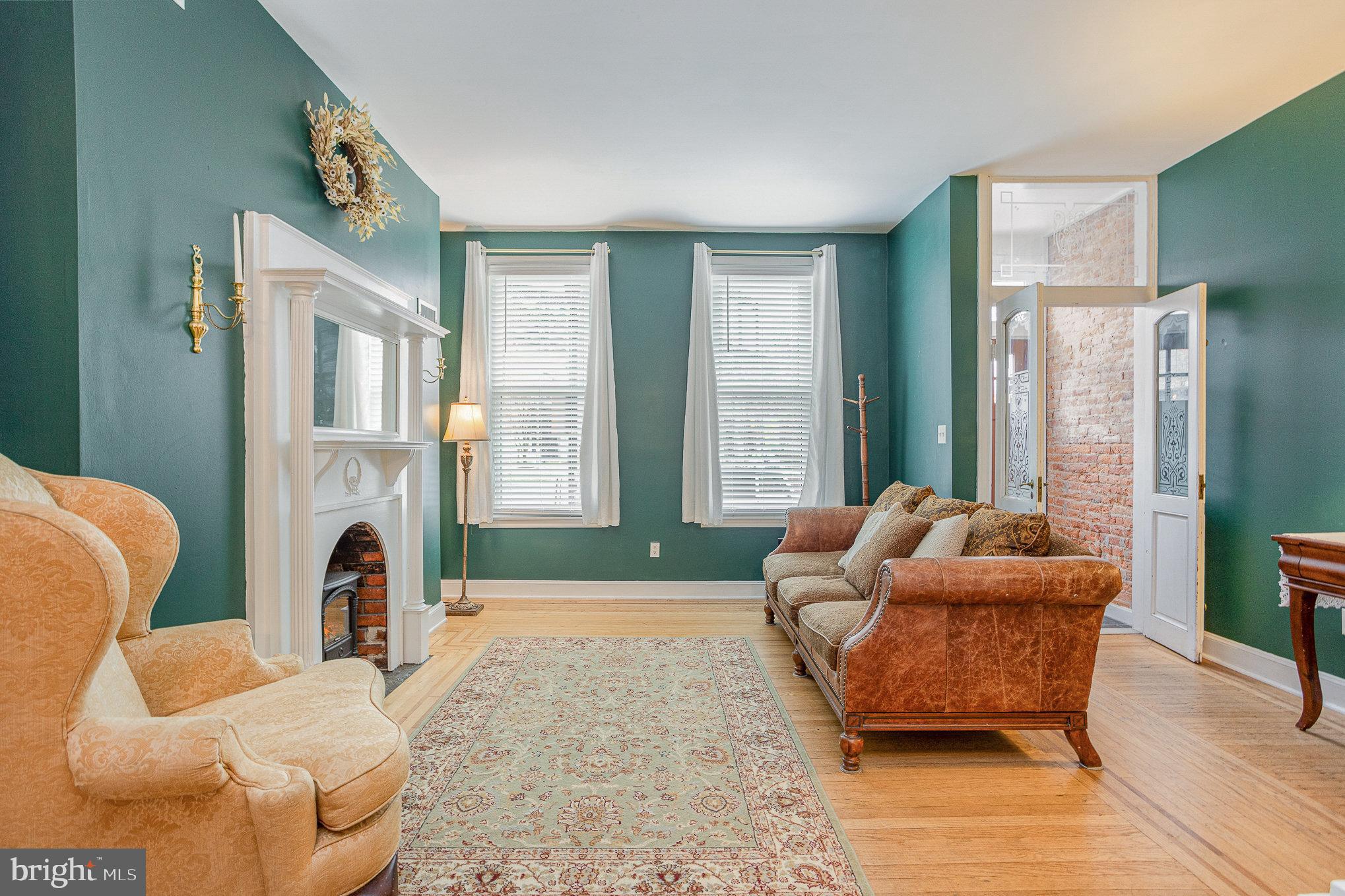 604 Washington Boulevard Baltimore, MD 21230 - Photo 3 of 30 a living room with furniture and a fireplace