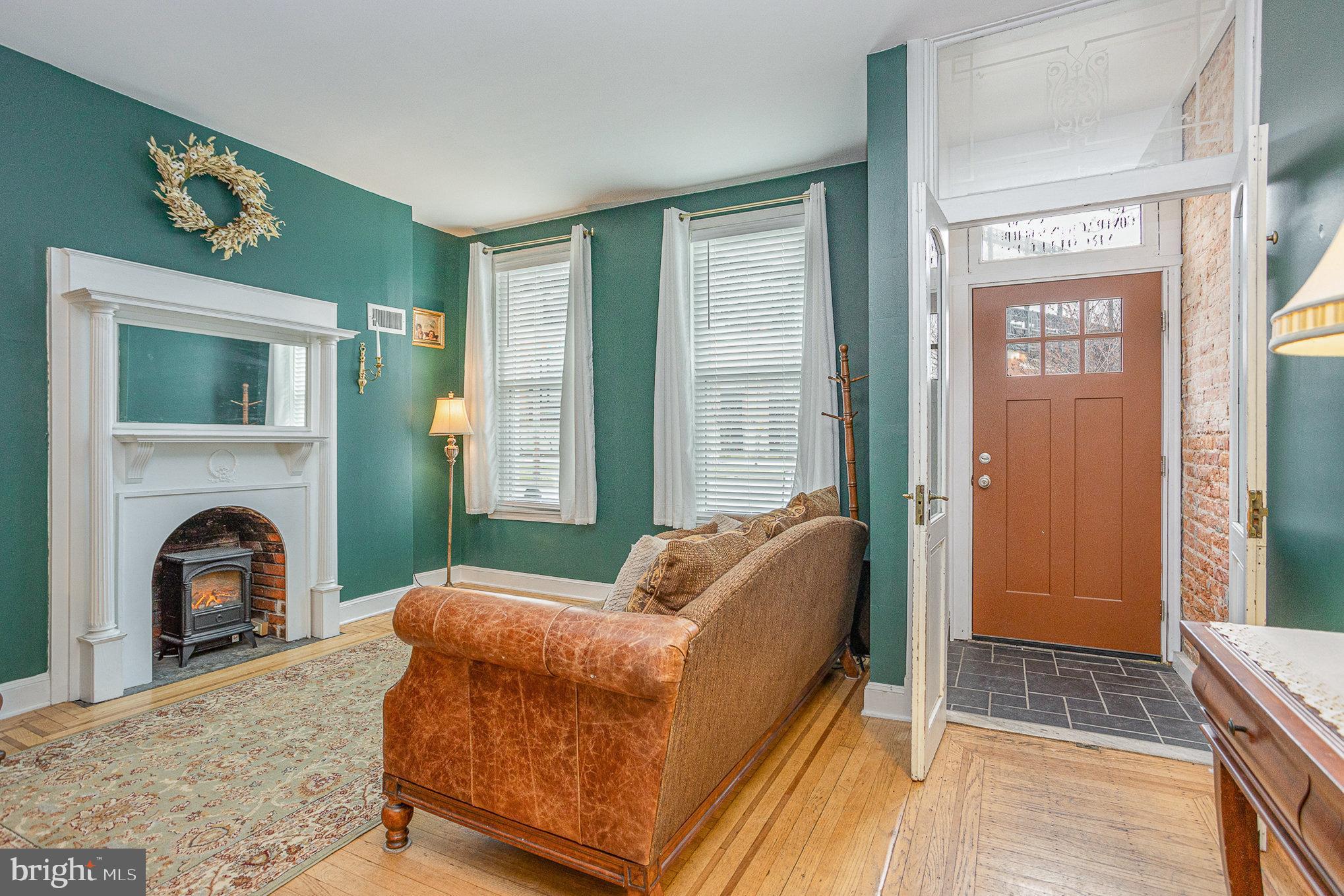 604 Washington Boulevard Baltimore, MD 21230 - Photo 6 of 30 a living room with furniture and a fireplace